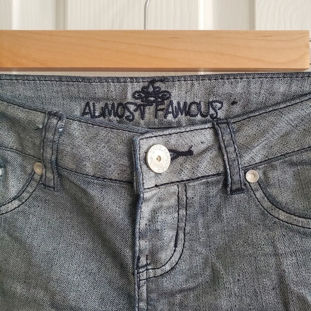 Almost Famous Metalic coated jeans size 3